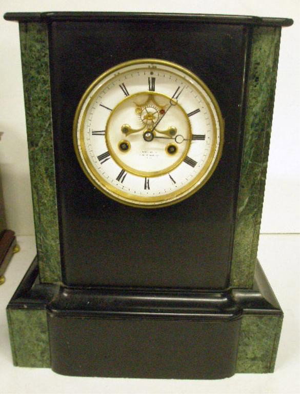 19th c. Leon Aron French Mantel Clock: Leon Aron Paris mantel clock, slate & green marble, porcelain dial, open escapement, brass time & strike movement, late 19th c., 11" x 15" x 6 1/2". [22]