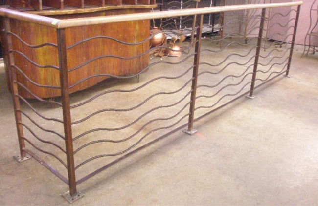 Modern Design Iron Railing: Modern design iron railing with oak tops, includes two 'L' sections. Custom made for Stelleto's Shoe Store Phila. Pa. late 20th c., hgt 42"; 148 1/2" x 27", 86" x 24".