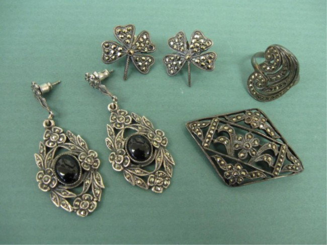 Vintage Sterling & Marcasite Jewelry Suite: Vintage sterling & marcasite jewelry suite, pair pierced earrings with onyx 2" length & 1 pair clover shaped; floral & scroll 1 3/4 x 1 1/4" pin; swirl shaped ring size 6 1/4, .95 ozt. total weight. A