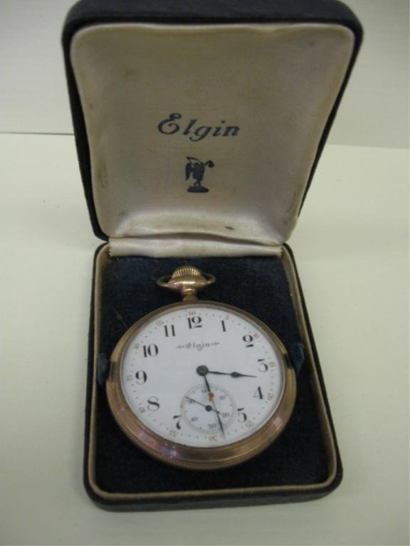 Elgin GF Open Face Pocketwatch: Elgin gf open face pocketwatch, 20 year warranted case, movement #11520910, screw back, size 12s, engine turned case w/shield & monogram. Case rough at screw back edges. Porcelain dial w/second hand. 