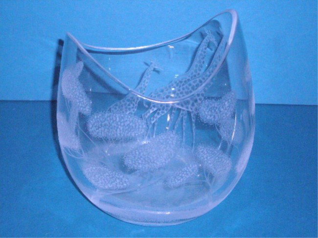 Kosta Crystal African Wildlife Vase: Kosta, designed by Vicke Lindstrand, crystal glass 9" x 6 1/4" African wildlife vase, intaglio cut giraffe & trees design, signed Kosta 42247 Lindstrand on base.