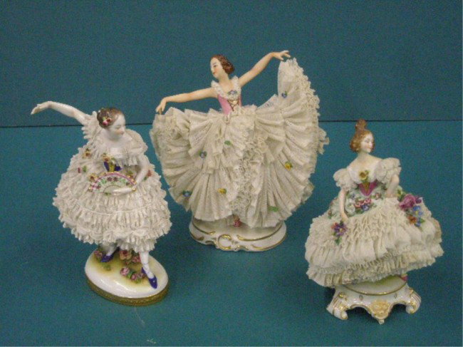 German Porcelain & Lace Dress Figures: Group of three German porcelain white lace dress female figures, unmarked 7" on pedestal base, Franz Witter Buhl 7" x 7 1/2" w/arms out & A. Lamm Dresden 7 1/2" w/fan in hand (all have sections of lac