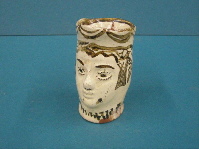 Continental Redware Pottery Face Pitcher: Early 20th c. Continental hand painted Redware pottery 5" face pitcher.