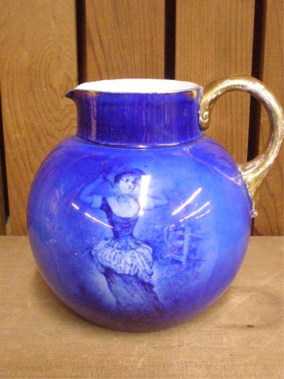 Flow Blue Pottery Pitcher: Late 19th/early 20th c. Flow Blue pottery 6" pitcher w/female & floral designs (crazing, scratches, gilt loss on handle)