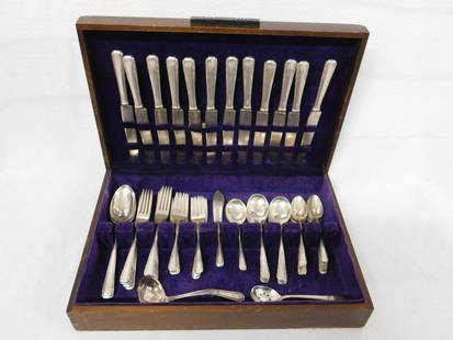 International Sterling Flatware Service: International Sterling Flatware Service, Courtship pattern, includes: 12 dinner forks, 10 dessert forks, 12hh dinner knives, 12 teaspoons, 12 soup spoons, 2 solid butter knives, three 6" serving spoon