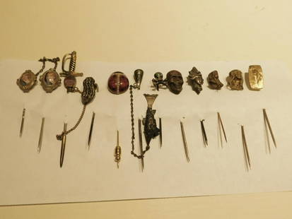 12 silver & other vintage stickpins: 12 silver & other vintage stickpins includes: Art Nouveau females, sword, peanut, skulls, enameled beetle, etc, 19th to 20th c. CONDITION: Many are tarnished & need cleaning.