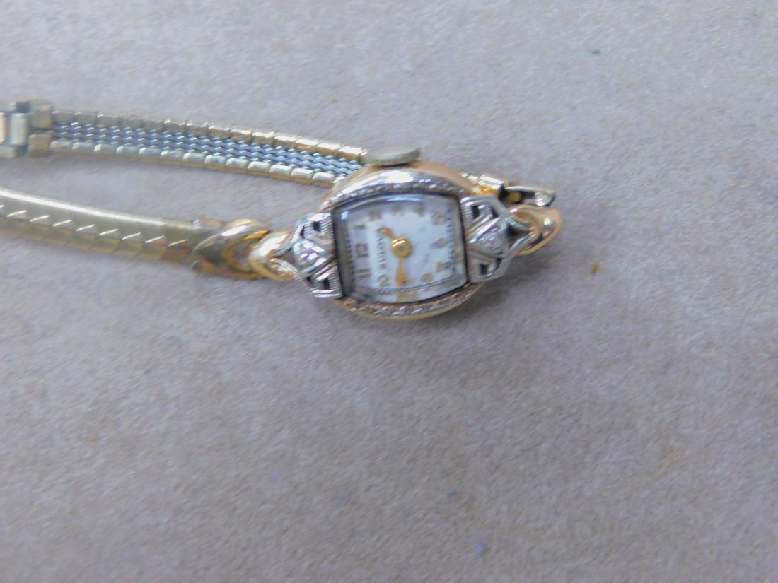 Gold & Diamond Lady's Wrist Watch: Gold and Diamond Lady's Wrist Watch, 14k yellow gold with white gold top holding wo pave set accent diamonds, Bulova 17 Jowel stem wind movement, back plate inscribed "M.M. from L.M."; 10k yold filled