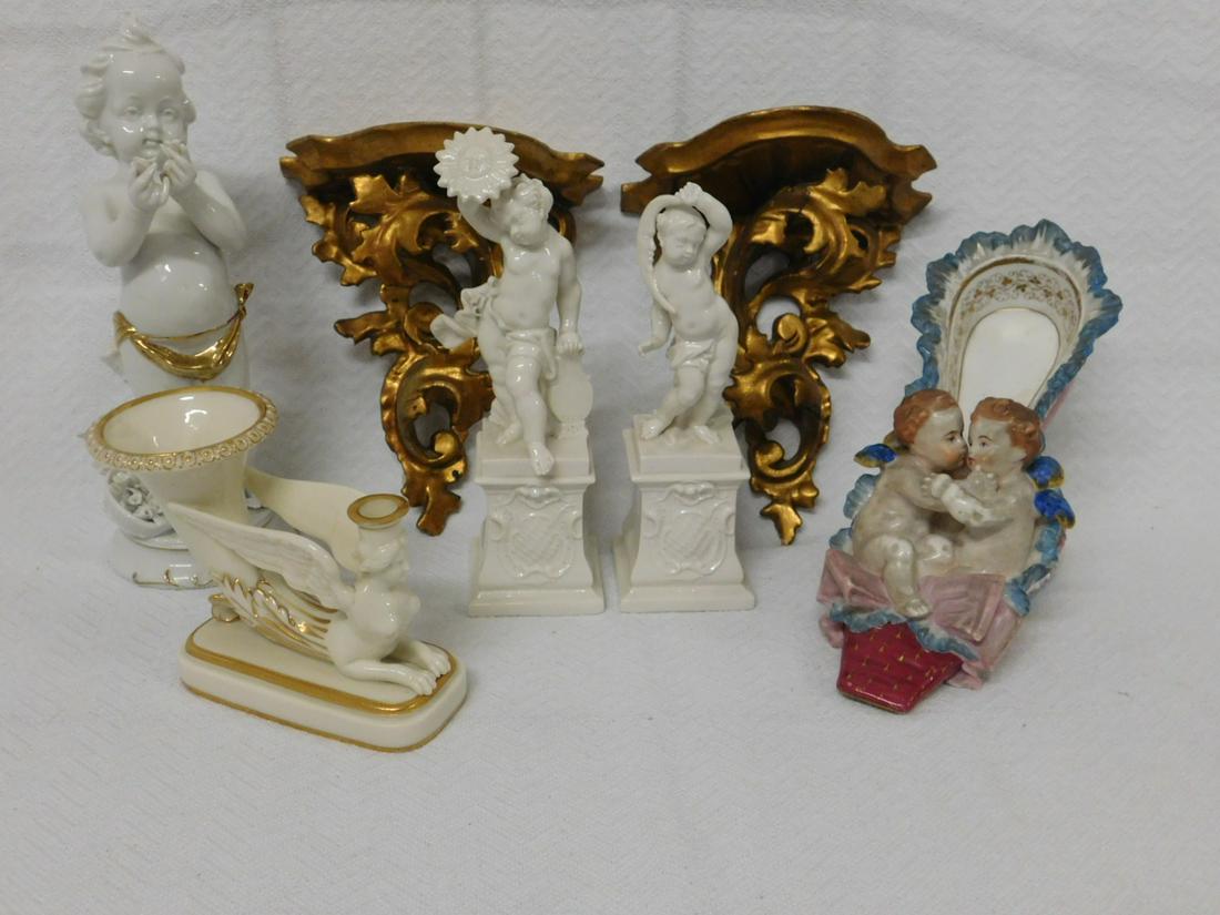 Putti Figures & Wall Brackets: Putti Figures and Wall Brackets, includes: pair of 7 1/2" Putti's on pedestals; a 9" Putti with flowers; a painted porcelain shoe with two embracing angels, 7 1/2" x 5 1/2"; a Worcester winged griffin