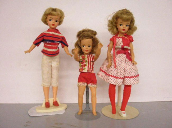 1960's Ideal Tammy & Pepper Dolls: 1960's Ideal Toy Corp. vinyl & plastic Tammy & Pepper dolls, two 12" 1962 Tammy & 8" 1963 Pepper, original stand for 1 Tammy doll, all have original clothes. Condition: All are very good with minor we