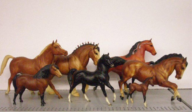 Vintage Breyer Plastic Horse Figures: Seven assorted vintage Breyer Molding Co. hard plastic horse figures, sizes range from 4 1/2" to 12 1/2". Condition: Very good with minor wear. Very good with minor wear.