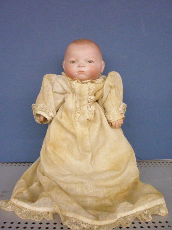 Grace Putnam Bisque Head Bye-Lo Baby Doll: 1923 Grace Putnam 13 1/2" German bisque head Bye-Lo Baby doll w/composition hands & cloth body. Condition: Doll is in very good condition with loss to 4 fingers on right hand, paint residue on hands, 