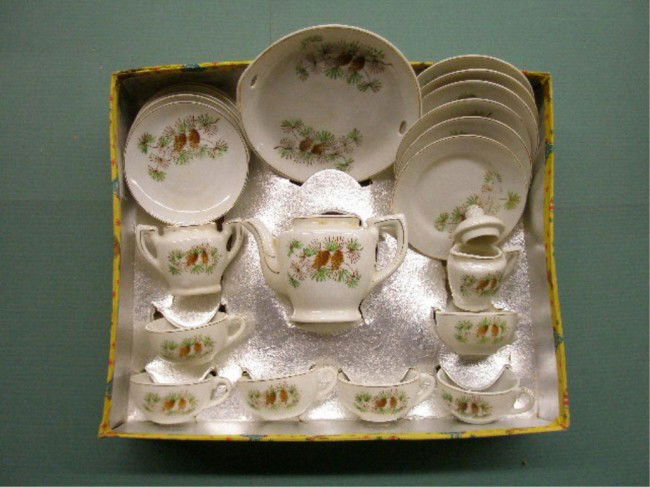 1940's Japanese Porcelain Child's Tea Set: 1940's Japanese porcelain 22 piece child's tea set w/original box. Condition: Very good w/broken handle on 1 cup, box has wear & tearing.