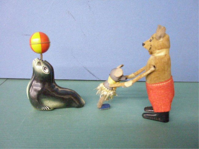 German Friction & Wind-Up Toys: 1950's German friction & wind-up toys, Lehman tin friction Seal & Schuco felt & tin wind-up Dancing Father & Daughter Mouse. Condition: Foot missing from daughter mouse, no key for Schuco, minor wear