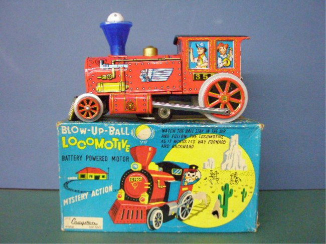 1950's Battery Operated Blow-Up-Ball Locomotive: 1950's Cragston Toys Japanese tin battery operated Blow-up-Ball Locomotive w/original box. Condition: Very good with minor wear, works, box has wear & tearing.