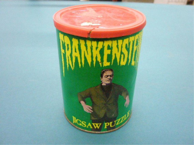 1974 Frankenstein Jigsaw Puzzle: 1974 American Publishing Corp. Frankenstein jigsaw puzzle with original container. Condition: Counted and there are 203 pieces, container has wear & split on lid.