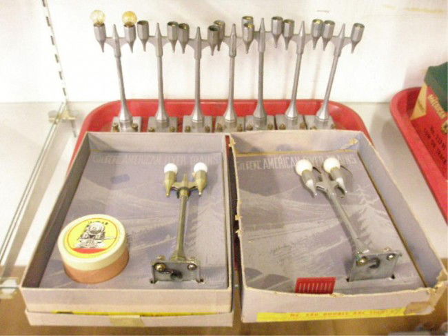 1940's American Flyer Double Street Lights: 1940's American Flyer "S" gauge #580 type 2 Double Street Lights, 2 w/original boxes (1w/tin), 7 unboxed. Condition: All have some form of wear & or loss, no box lid or tin for 1, boxes have wear, 6 m