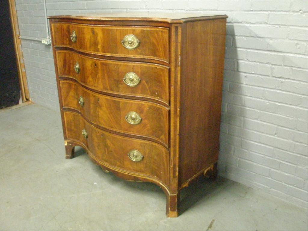 Southern Hepplewhite Mahogany Chest of Drawers: Hepplewhite mahogany inlaid boldly serpentine four-drawer chest, the drawer fronts, canted corners, and shaped skirt with banding, modified herringbone inlay, and line inlay, French feet. Southern, po