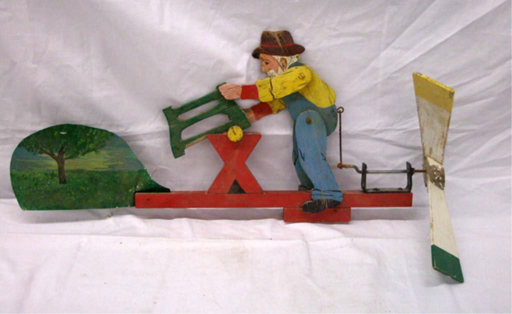 Vintage Folk Art Figural Whirligig: Vintage folk art carved & painted wood 12" x 25" figural whirligig, depicting an elderly man sawing. Condition: Areas of wear & loss, 2 wood spokes missing from back section & metal portion front piec