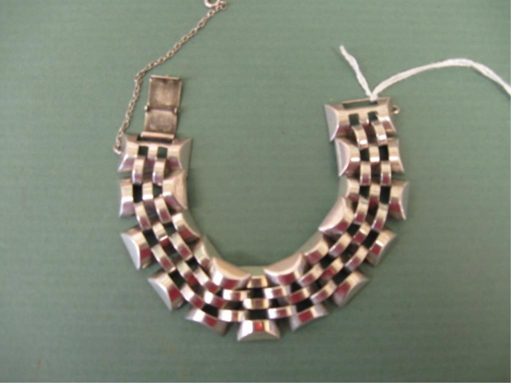 Vintage Sterling Monet Bracelet: Vintage sterling Monet bracelet, flexible interwoven links, 7" length, 1" width, safety chain, 1.6 ozt. Cond. VG normal patina.