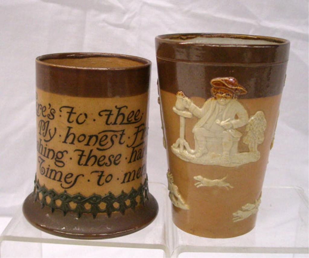 Royal Doulton Lambeth Mug & Beaker: Royal Doulton Lambeth stoneware 4" poetry mug & 4 5/8" beaker with relief figures & animals. Condition: Small chip on top rim of mug, beaker is very good with no damage.