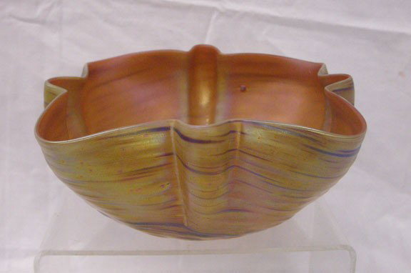 Palme Koenig Art Glass Bowl: Palme Koenig Austrian art glass 7 1/4" x 3 1/2" bowl, iridescent gold with purple line design, ribbed outer body, crimped top rim, raised bubble like formations on base. Condition: Very good with impe