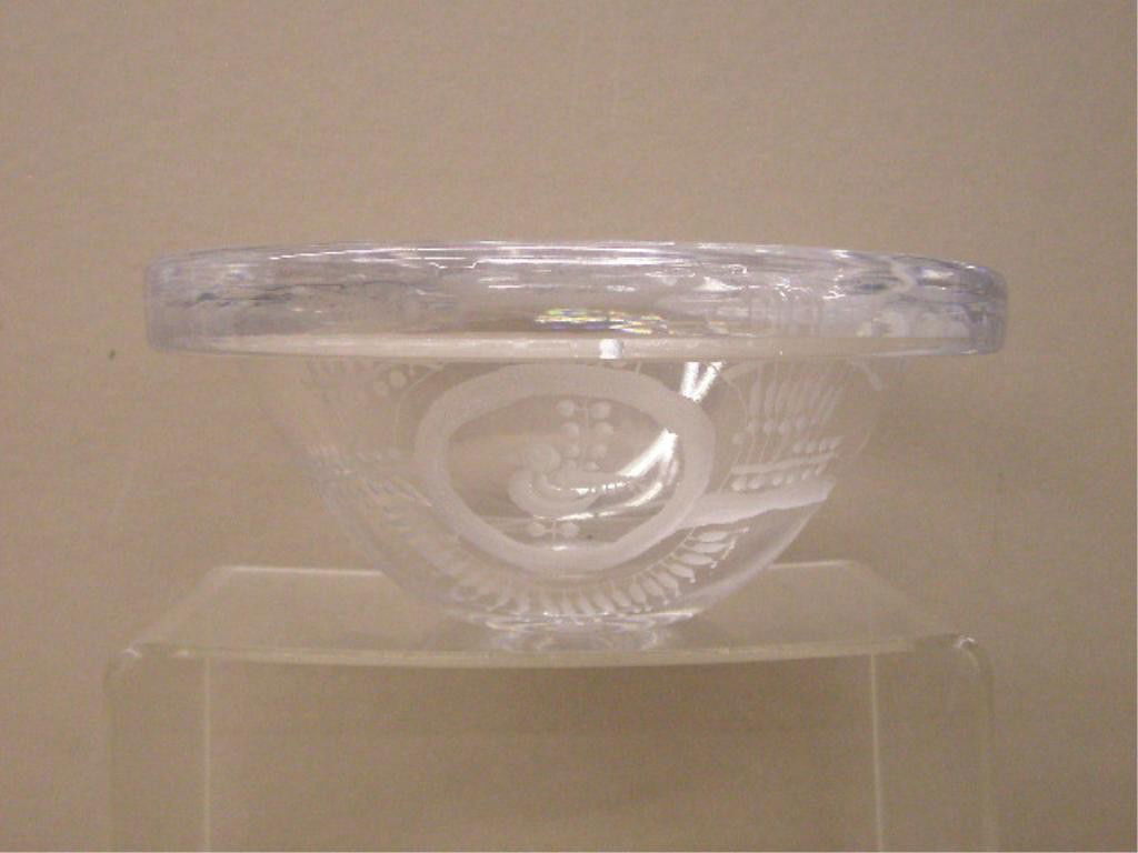 Kosta Boda Goran Warff Bowl: Vintage Kosta Boda clear glass 7 1/2" x 3" bowl, designed by Goran Warff, etched bird & stylized floral design, signed on base Kosta, WG5683. Condition: Very good with scratches on base.