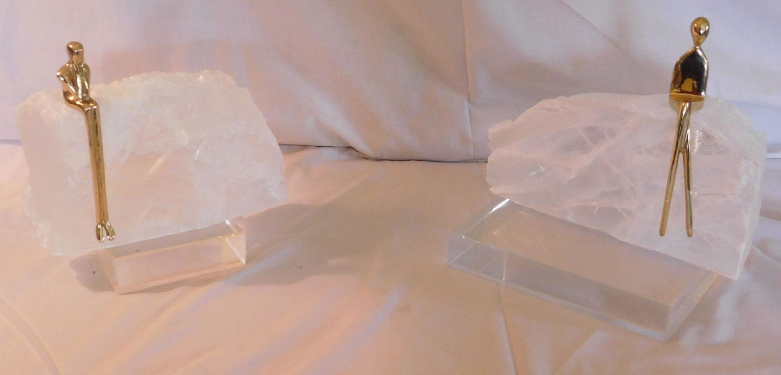 Pair Mica? crystal rock with seated figures: Pair Mica? Crystal rock with seated figures, both on lucite bases, approx. 8 1/2" l. x 7" h. each, Condition; very good