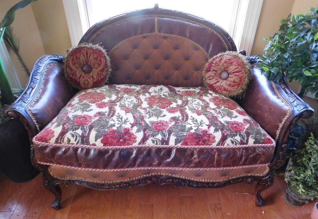 Louis XV style loveseat: Louis XV style love seat, dark mahogany finished frame with floral and acanthus carvings, brown leather and cloth upholstery with tapestry style seat, 48" l. x 36" h. Condition: slight scratches on le