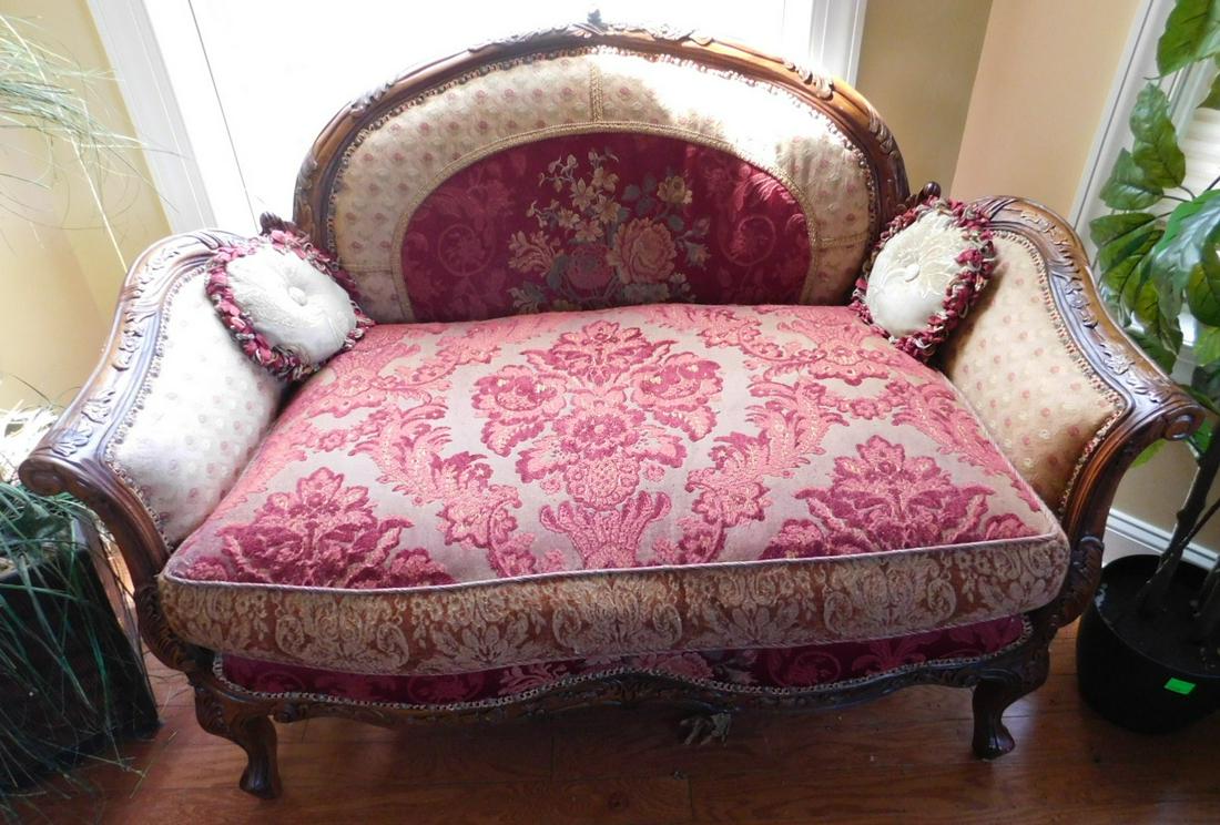 Louis XV style love seat: Louis XV style love seat, mahogany finished frame with floral and acanthus carvings, floral brocade cloth upholstery with tapestry style seat, 48" l. x 36" h. Condition: areas of wear to upholstery an