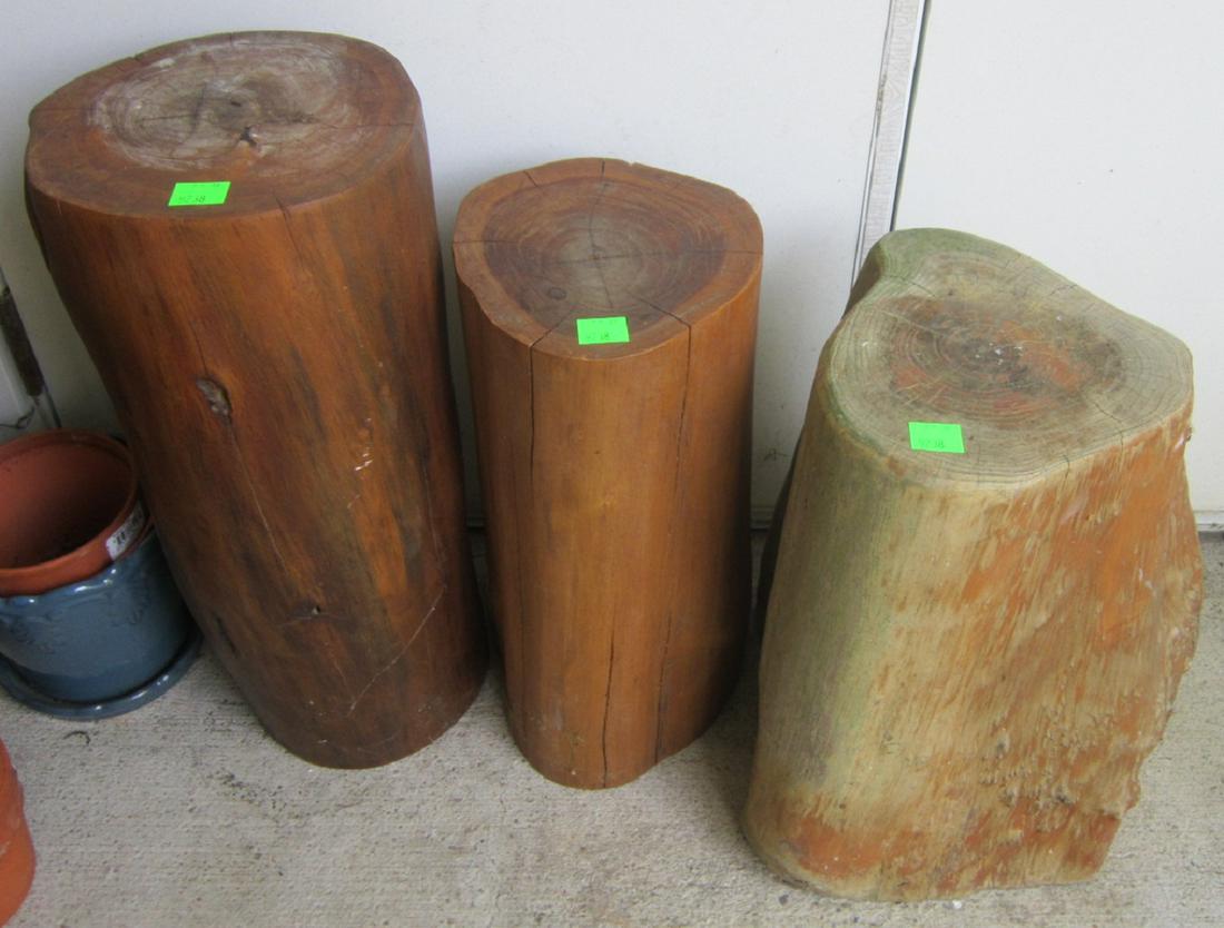 (3) Refinished log pedestals: (3) refinished log pedestals, 18" - 22" h. Condition: one badly weathered, one with water stained top. NOTE: NO SHIPPING ON THIS LOT. LOCAL PICKUP ONLY!