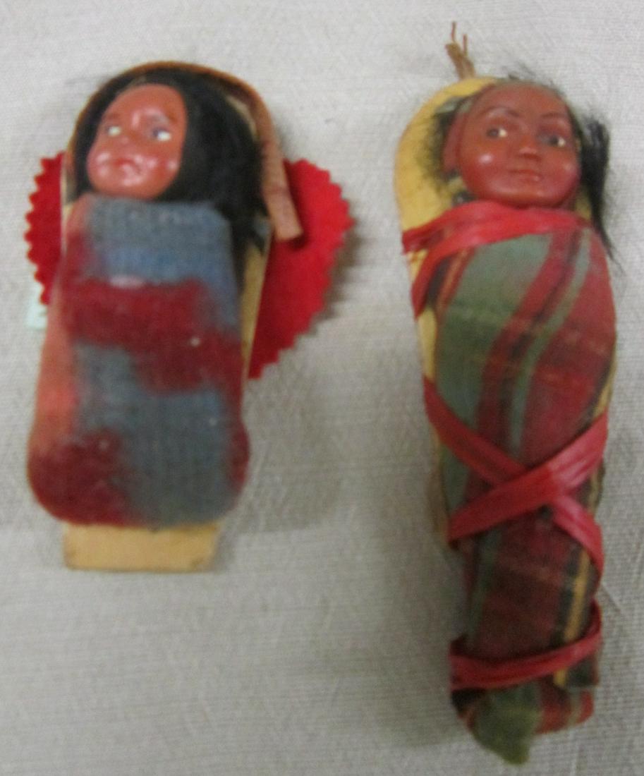 Small Native American Dolls: Early 20th c. Native American dolls on cradle boards, composition heads, vintage fabric. CONDITION: some wear from use