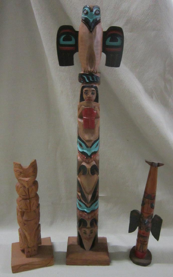 3 Totem Poles: 3 Mid century totem poles, one signed Chief Johnson Ketchikan Alaska, 8" h. (1) 18 1/2" h. x 4" w, plus newer totem, illegibly signed, 1977. Condition: Good
