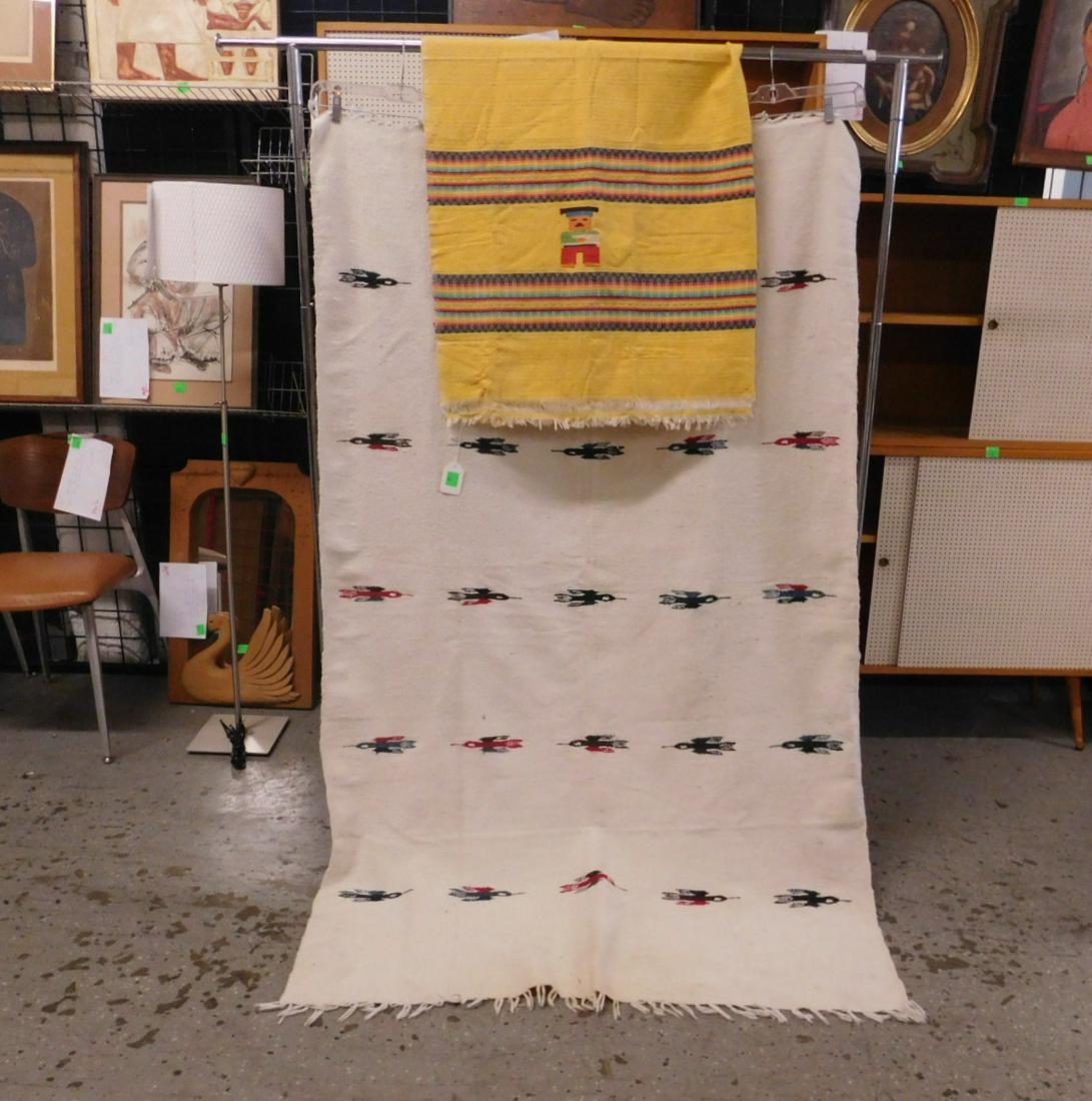 Mexican Blanket & Cover: Mexican Blanket and Cover, includes:(1) rows of Thunderbirds on a white filed, 3.11' x 6.4', some small dirt areas, and (1) cover with four embroidered Mexican figures between patterned bands on a yel