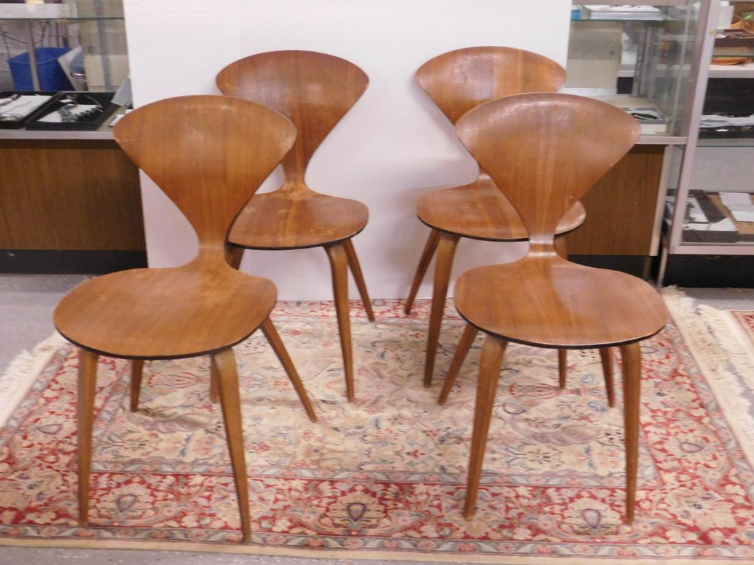 4 Norman Cherner MCM Chairs: Four Norman Cherner MCM Chairs, walnut laminated with molded contour seats and wood legs,Van Sciver labels, 31"h. CONDITION: Used with areas of finish rubs and wear, one chair with small front seat ed