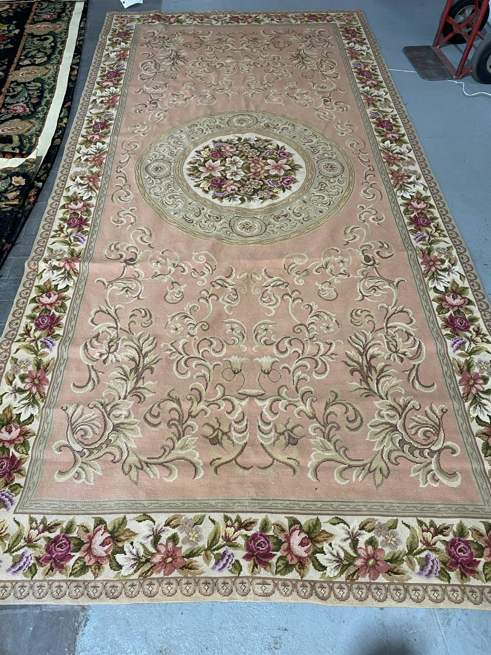 Aubusson Carpet: Aubusson Carpet, 5'1" x 10'6", by Empire, mauve, reds and greens, floral. [37] CONDITION: Very good, light use.