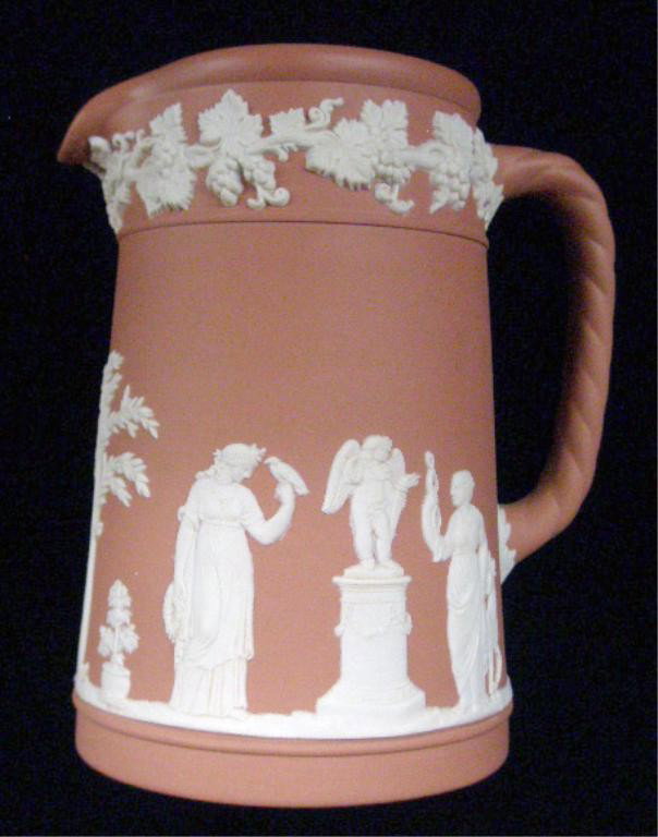 Wedgwood Jasperware Pitcher: Wedgwood salmon Jasperware 5" milk pitcher. Condition: Very good with no damage.