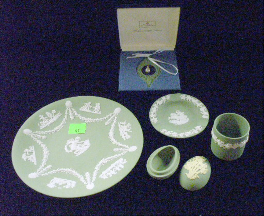 Wedgwood Jasperware Group: Wedgwood green Jasperware group, 8 3/4" plate, 4 3/4" round ashtray, 2 1/4" cigarette holder, Millenium Gems ornament with box & 1 3/4" x 2 3/4" x 1 3/4" egg form box. Condition: Very good with no dam