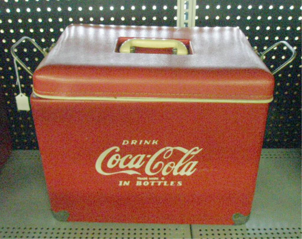 1960's Coca Cola Picnic Cooler: 1960's Royal Mieco Inc. vinyl covered Coca Cola 16 1/2" x 14" x 11" picnic cooler with attached original bottle opener. Condition: Scratches & wear, missing one hook attachment & tray insert.