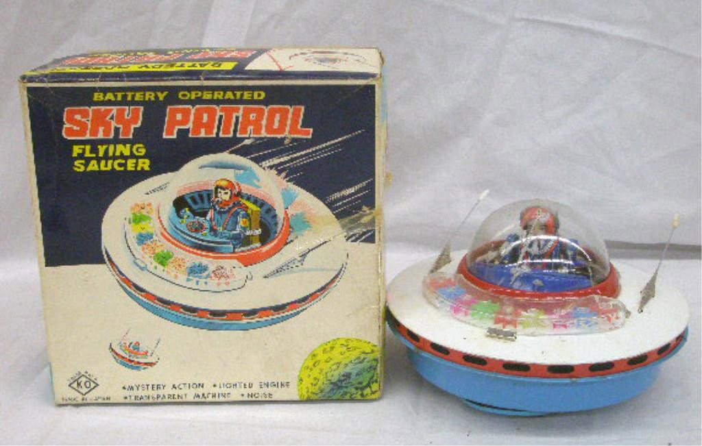 1950's Japan Sky Patrol Flying Saucer: 1950's K-O Co. Japanese tin battery operated Sky Patrol Flying Saucer with original box. Condition: Not working, cracks & shatters on plastic dome, section loss on plastic covering, minor wear on tin,