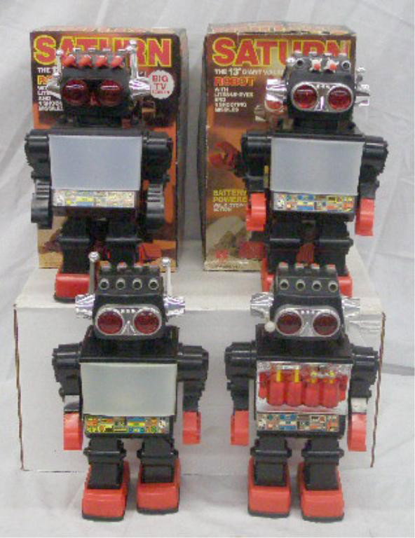 1990's Battery Operated Saturn Robots: Lot of four 1990's plastic battery operated Saturn The 13" Giant Walking Robots, made in China, 2 with original boxes. Condition: 2 with boxes & 1 without box work, 1 with box is missing 2 missiles, 1