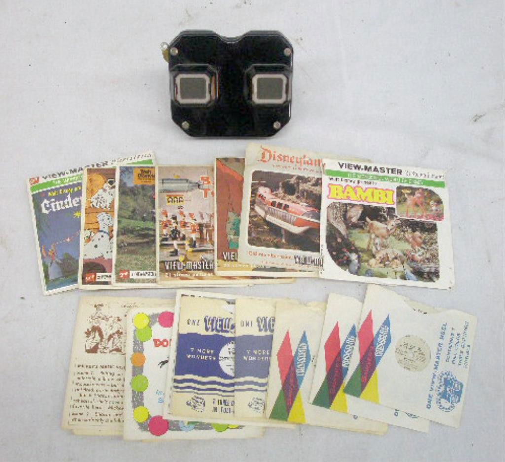 1950's View Master & Reels: 1950's View Master viewer & 34 assorted 1950's & 1960's Walt Disney reels. Condition: Viewer is very good with no damage, reels & holders have minor wear.
