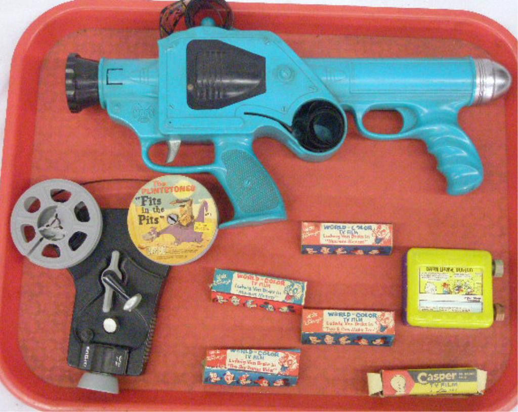 1960's Film Viewers & Film: 1960's cartoon film viewers & film, Louis Marx & Co. Inc. plastic gun form viewer with attached Blondie film, Argus Movie Viewer with applied 8mm Flintstones film, Lido Television viewer with applied
