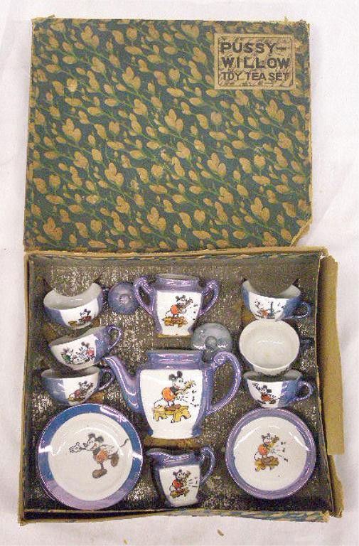 1930's Mickey Mouse Child's Tea Set: 1930's Japanese porcelain eighteen piece Mickey Mouse child's tea set with original box. Condition: Very good with no damage, missing 3 saucers, box has wear & tearing.