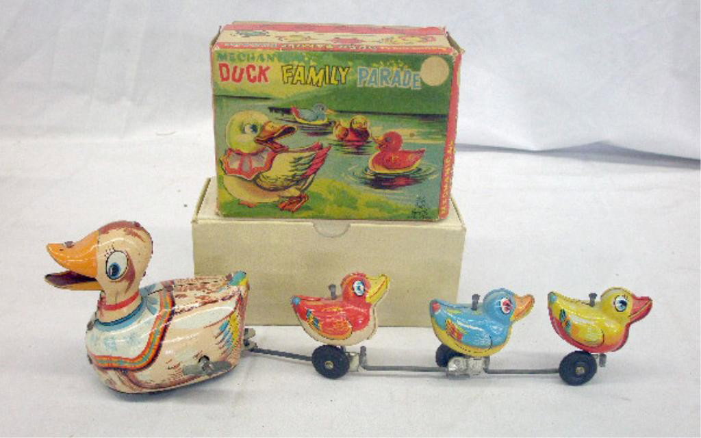 1950s Japan Tin Wind-Up Duck Family: 1950's T.P. S. Japanese lithographed tin wind-up Mechanical Duck Family Parade with original box. Condition: Not working, very good with areas of minor wear & or loss, box has wear.