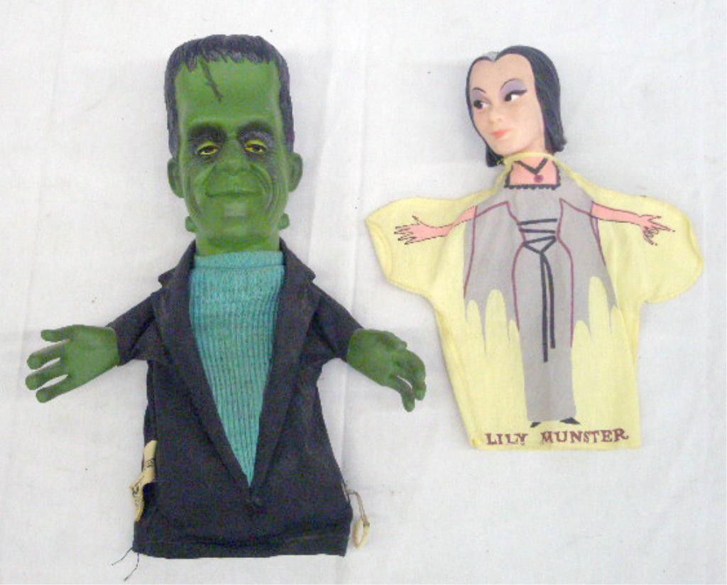 1964 Herman & Lily Munster Puppets: 1964 Mattel Inc. talking Herman Munster & 1964 Kayro-Vue Productions Lily Munster hand puppets. Condition: Herman does not work, both are in very good condition with minor wear.