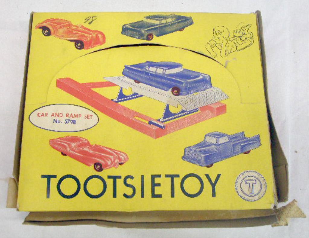 1950's Tootsietoy Car and Ramp Set: 1950's Tootsietoy diecast metal No. 5798 Car and Ramp set with original box. Condition: Cars & ramp are very good with minor wear, box has wear & tearing.