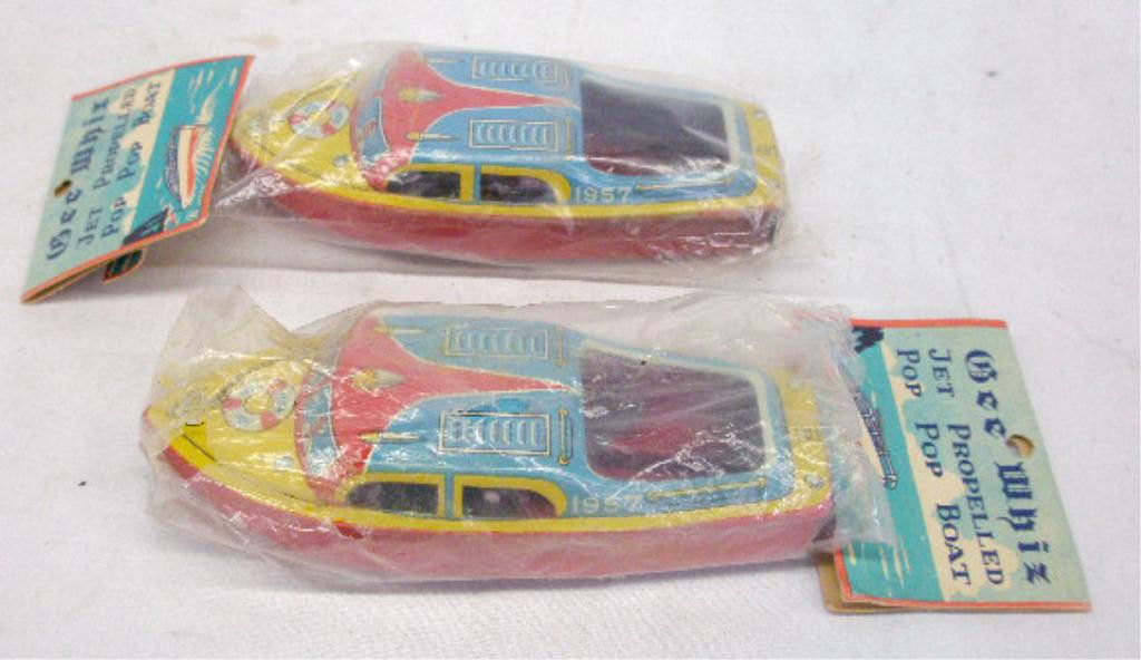 1950's Japan Tin Pop Pop Boats: Two 1950's Japanese lithographed tin Gee Whiz Jet Propelled Pop Pop Boats, 1 sealed in original packaging & 1 with original packaging. Condition: Very good with no damage, header top detached on 1 pac