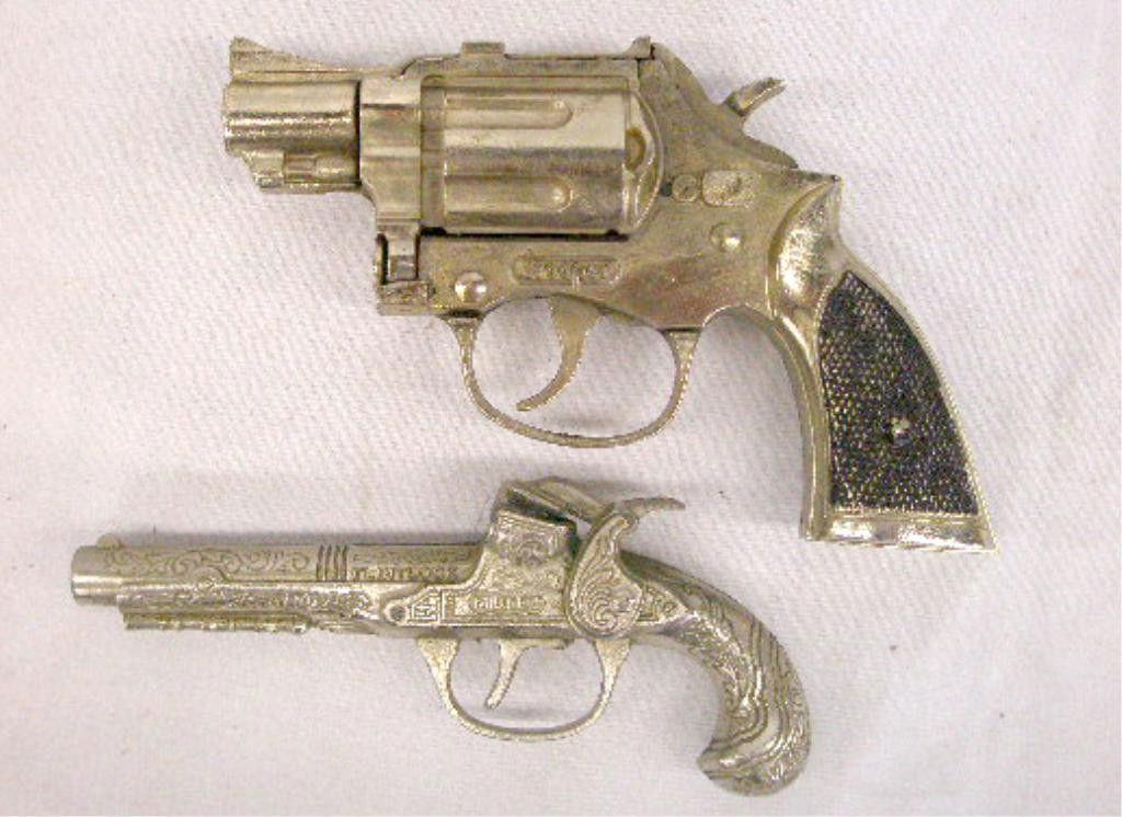 Vintage Hubley Toy Cap Pistol & Gun: 1950's & 1960's Hubley Manufacturing Company Flintlock Midget & Trooper toy cap pistol & gun. Condition: Both are very good with minor wear.