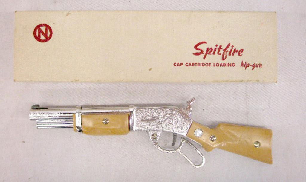 1950's Nichols Toy Cap Gun: 1950's Nichols Spit Fire cap cartridge loading lever action toy cap gun with original box. Condition: Very good with no damage, box has minor wear.
