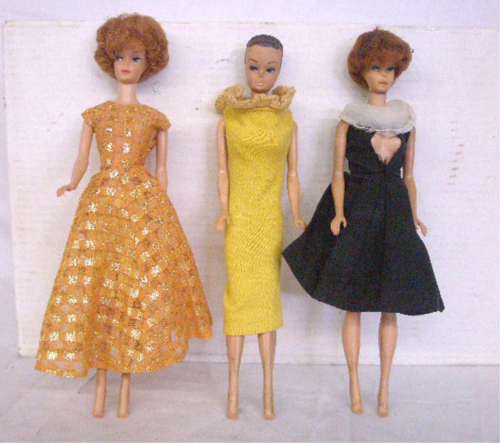1960's Mattel Midge Dolls: Lot of three 1960's Mattel Inc. Midge dolls, 2 with bubble cut hair & 1 with painted hair. Condition: All have some form of minor wear, black & white dress is torn.